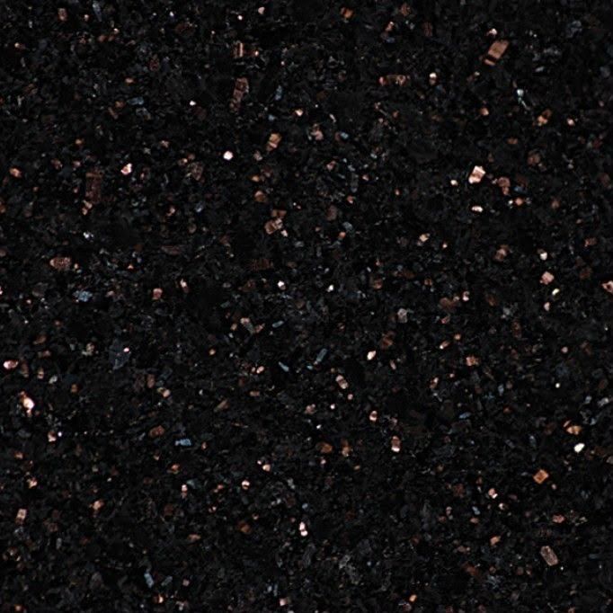 Black granite with bronze crystal flecks, macro view