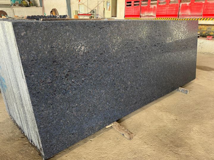 Blue-black granite slab with blue crystals and a textured leathered finish