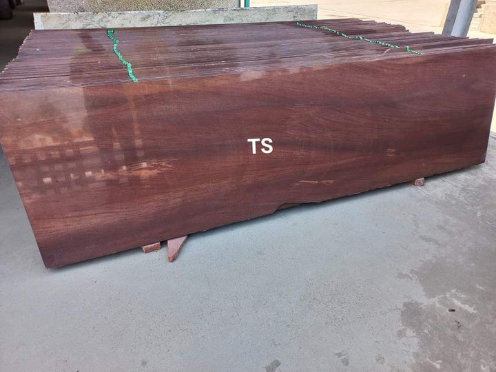 Stack of polished wood-grain slabs