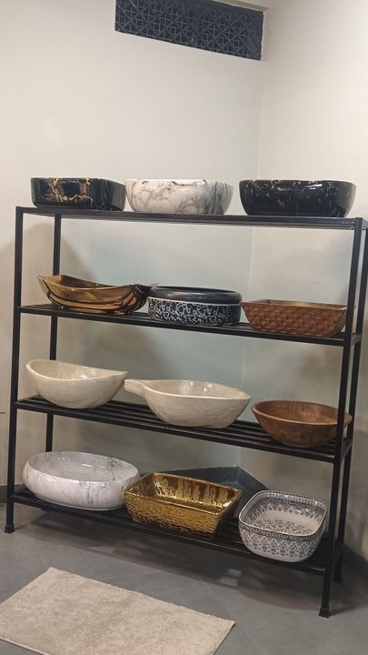 Metal rack of assorted designer vessel basins