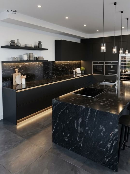 Modern kitchen with black granite counters and a white-veined black island