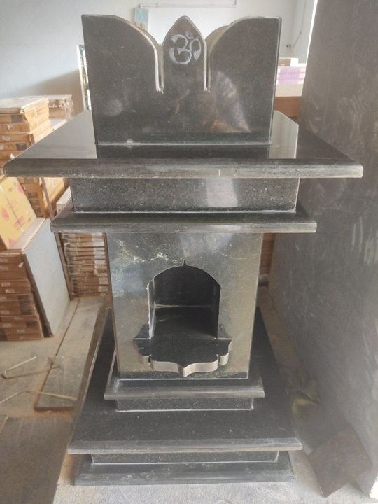 Grey and black granite pooja unit with Om carving