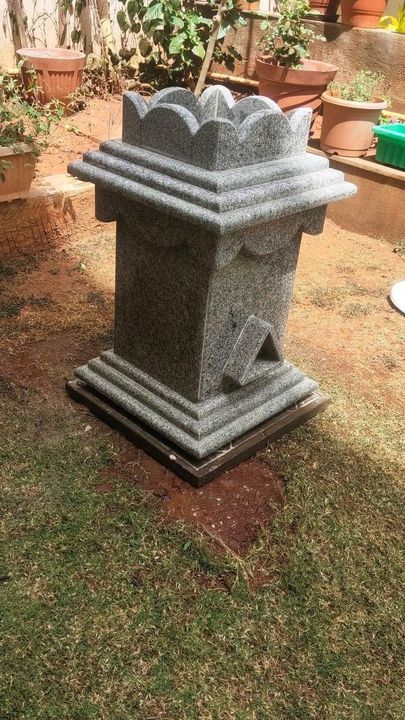 Grey granite tulsi madam with lotus crown in a garden