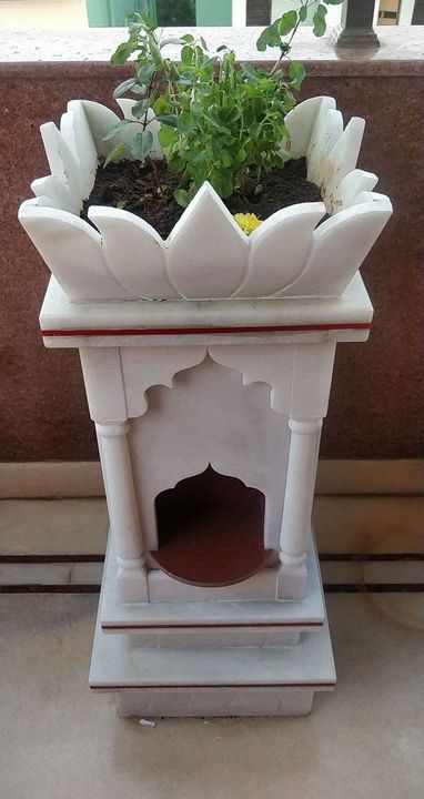 White marble tulsi madam with lotus petals and a tulsi plant