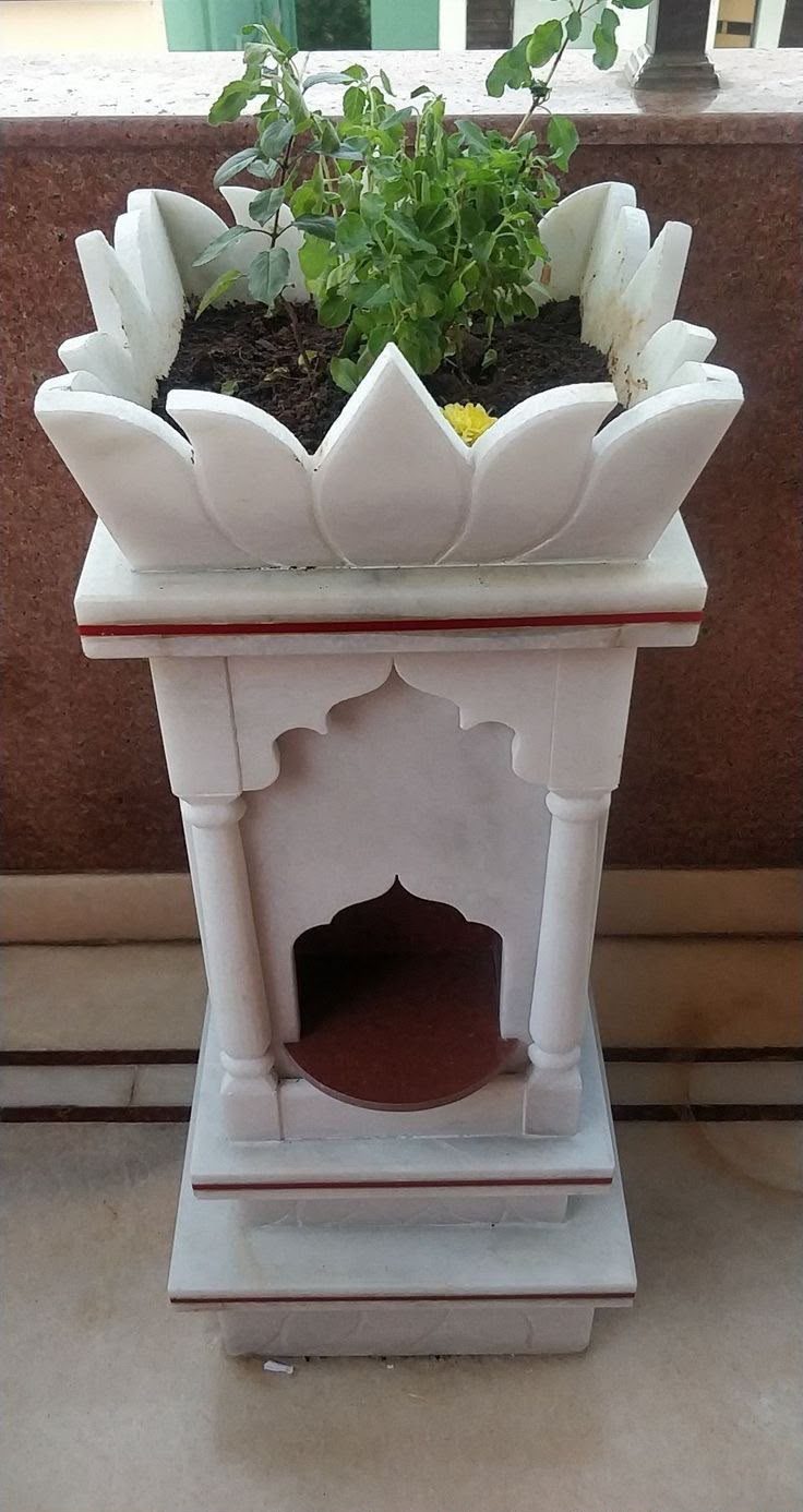 White marble tulsi madam with lotus petals and a tulsi plant