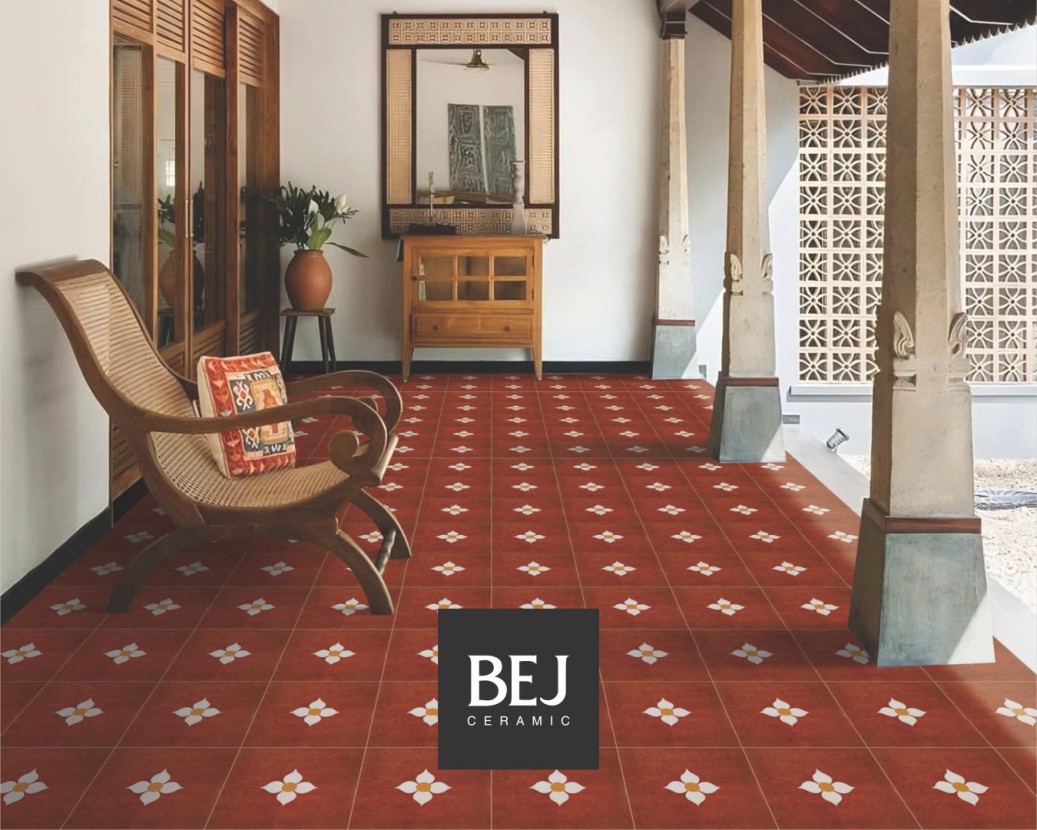 Close-up of Athangudi Series Petal Red pattern on a heritage floor